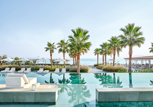 Lounging by The Pool at Grecotel Margo Bay & Club Turquoise