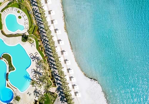 Aerial view of the beachfront and main pools at Sani Beach in Halkidiki, 