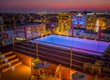 Novus City Hotel Rooftop Pool Night
